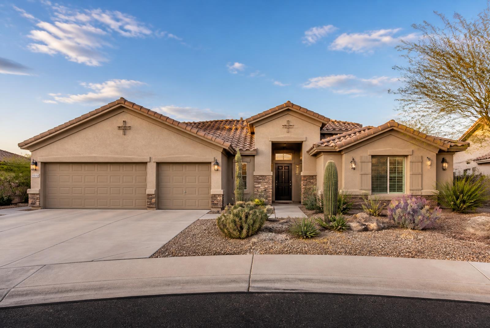 Single-story Arizona home with tile roof and desert landscaping in Surprise